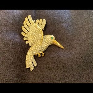 Beautiful large bird brooch with diamonds.lovely on scarves or coats.